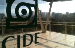 The CIDE logo on glass doors with Santa Fe in the distance