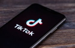 A cell phone displaying the TikTok logo