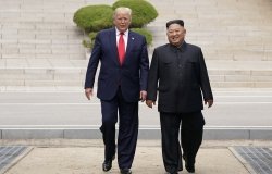 Donald Trump and Kim Jong Un walking together.