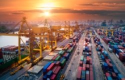 An image of a shipping port unloading containers.