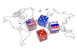 Amap of the world with dice representing the flags of the U.S., the EU, China, and Russia