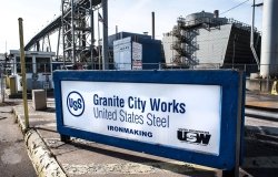 A manufacturing plant in the background with a sign that says Granite City Works United States Steel