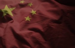 The Chinese flag, rumpled up with dark shadows on the edges.