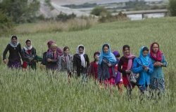 In this Thursday, Aug. 18, 2016 photo, young girls walk towards their school, in Wakhan, Badakhshan province, far northeastern Afghanistan.