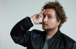 Man posing with hand on head