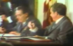 Leonid Brezhnev and Richard Nixon playfully signing an agreement in June 1973