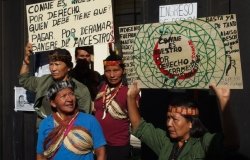 Indigenous Shuar native women from Ecuadorian Amazon protest against mining and oil concessions outside the Conaie headquarters in Quito, Ecuador in 2015