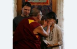 His Holiness the Dalai Lama Hugs Journalist Amy Yee in 2008