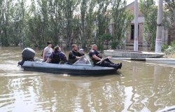 Group on boat in flooded area