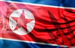 A North Korean flag with an image of the U.S. Capital Building and a set of missiles in the background.