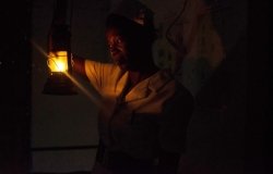 Women lighting a lantern.