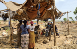 Women hauling ore in a mine site near Djidjan-Keniéba, Mali.