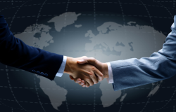 Handshake in front of world map