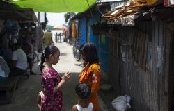 Bangladeshi children stand outside in Barisal.