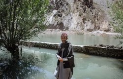 An Afghan farmer stands in front of his flooded garden in Afghanistan’s northeastern Panjshir Province, where a glacial lake bursts, triggering a landslide that killed ten people. 