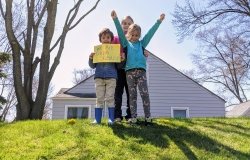 Children holding a sign of we are citizen scientists