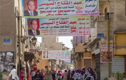 Banners supporting current Egyptian president Abdel-Fattah El-Sisi for a second term for the presidential elections at crowded Al Moez Street, Gamalia district