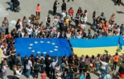 Crowd holding EU and Ukrainian Flag