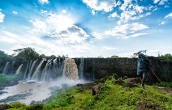 A boy stares at the Blue Nile Waterfalls