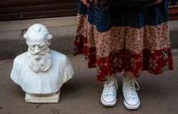 image of legs next to bust on ground 