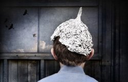 Young person wearing a tin foil hat