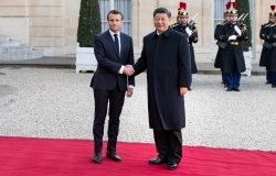 Macron and Xi Jinping Shaking Hands