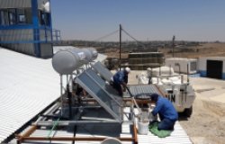 Workers installing solar power unit