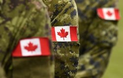 Canadian Soldiers with Flags on Arms