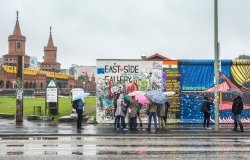 BERLIN, GERMANY - SEPTEMBER 24: The startin of the East Side Gallery with tourists on September 24, 2013 in Berlin. 