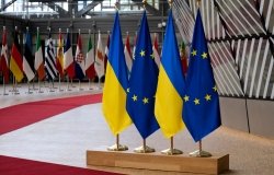 EU and Ukraine Flags on a Podium
