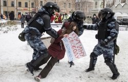 Police tackling a protester 