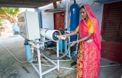 A rural woman while operating water treatment plant