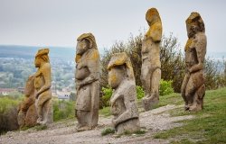 image of ancient statues on a hillside 