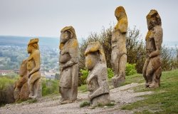image of ancient statues on a hillside 