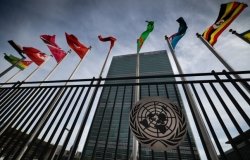 Flags at the UN Secretariat building in New York, courtesy of Viktor_IS/Shutterstock.com. 