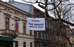 Sign that reads: "Putin the Hague Awaits you!" 