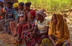 A group of women gathered outdoors in Abuja, Nigeria