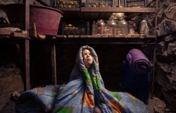 Ukrainian child takes shelter in her basement