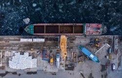 Aerial view from above of the river port with gantry cranes. Cranes in the cargo port of Togliatti in winter.