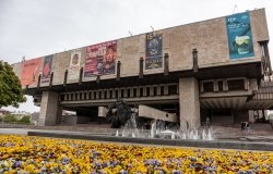 Kharkiv, Ukraine - May 08, 2021: The Kharkiv State Academic Opera and Ballet Theatre with fountains and vibrant pansies flowers blooming in spring