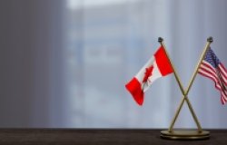 Canadian and US Flags on a Table