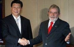 Then Chinese Vice-President Xi Jinping (L) shakes hands with Brazilian President Luiz Inacio Lula da Silva, during a meeting in Brasilia, Brazil on February 19, 2009.