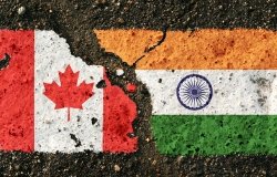 Canadian and Iranian Flags on Pavement