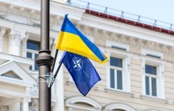 NATO and Ukraine Flags on pole