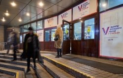 Posters of presidential elections decorate the entrance to the building of Vladivostok State University