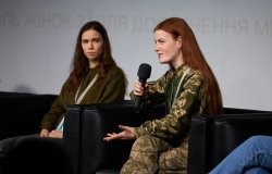 Oksana Rubaniak speaks at forum Arm Women Now in Kyiv