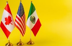 US Mexico and Canada flags on desk