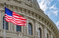 Washington DC Capitol dome detail with waving american flag